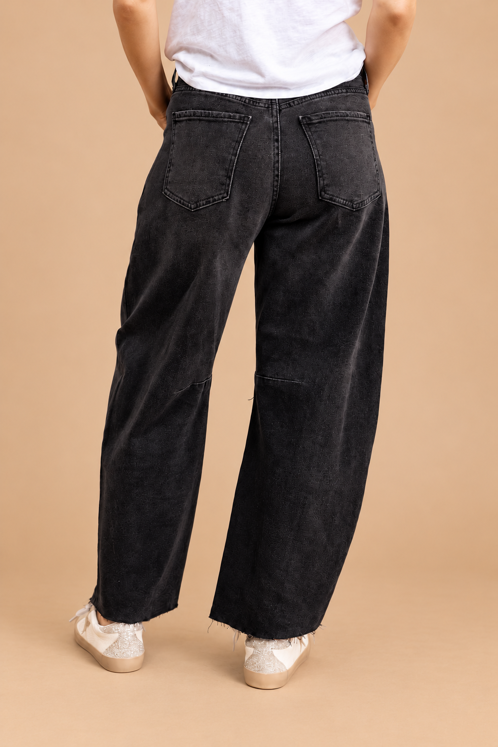 Barrel Jean — Washed Black, back view on tan background