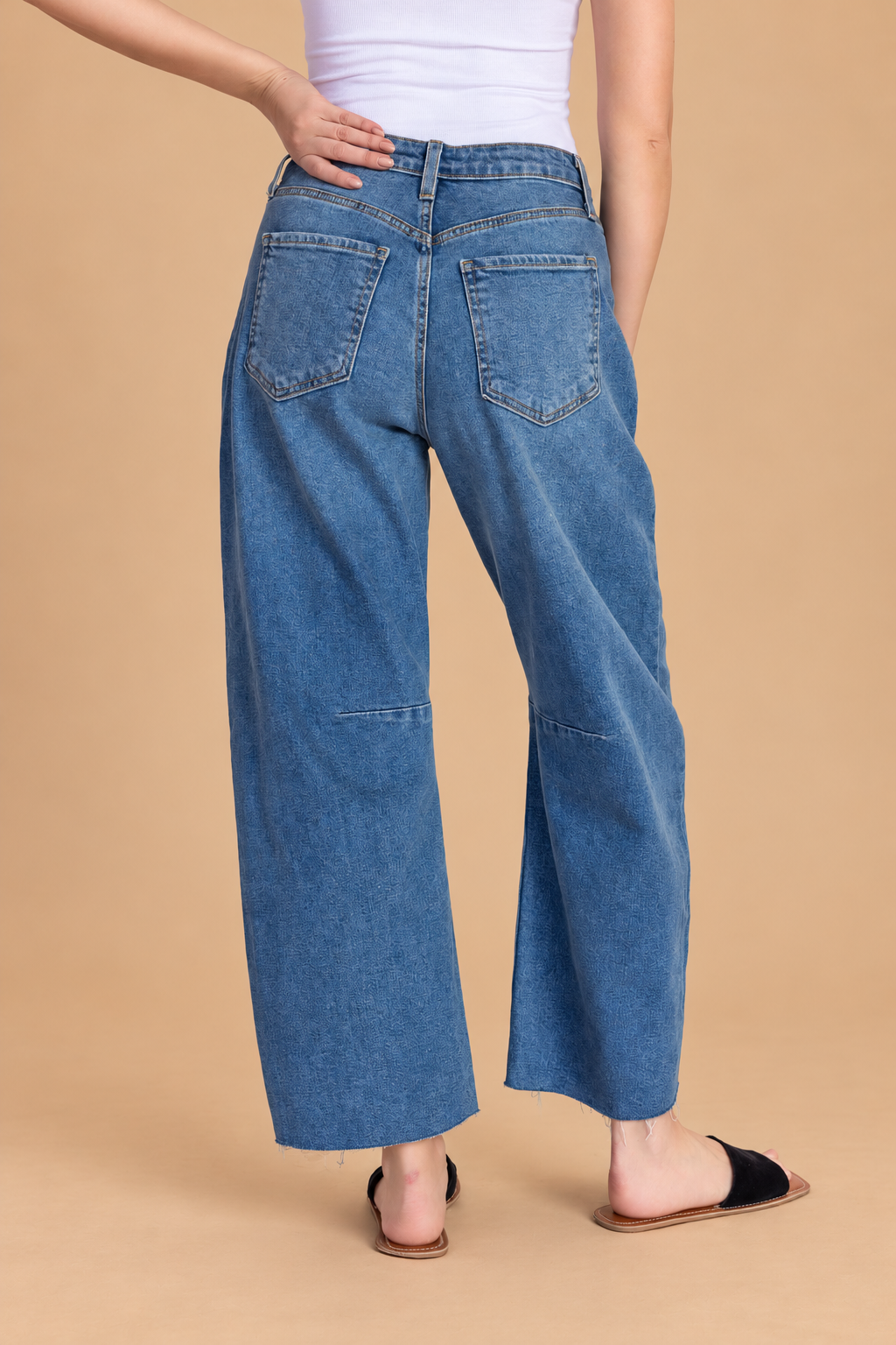 Barrel Jean — Medium Denim, back view on tan background