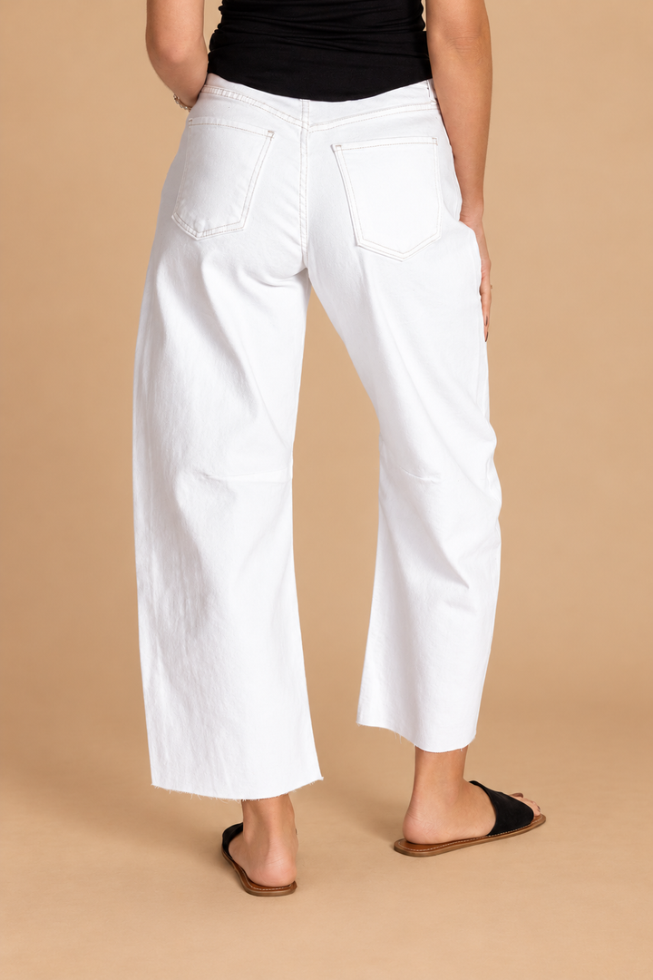 Barrel Jean — Off White, back view on tan background