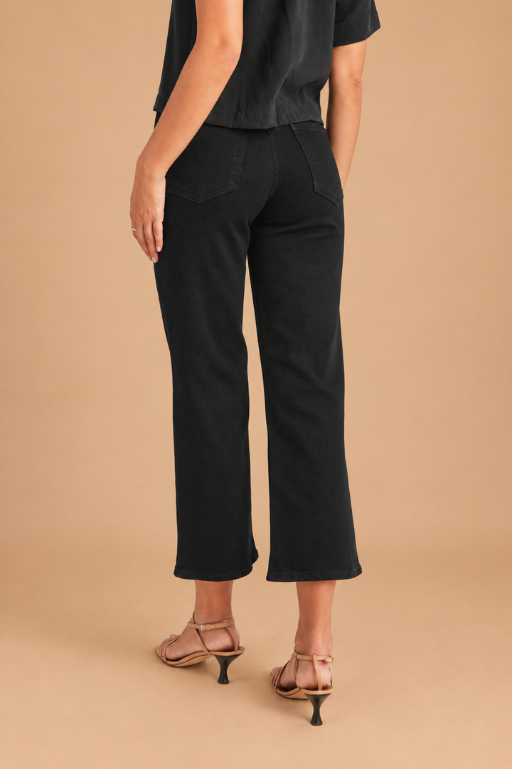 California Classic Wide Leg Jeans — Black, back view on tan background