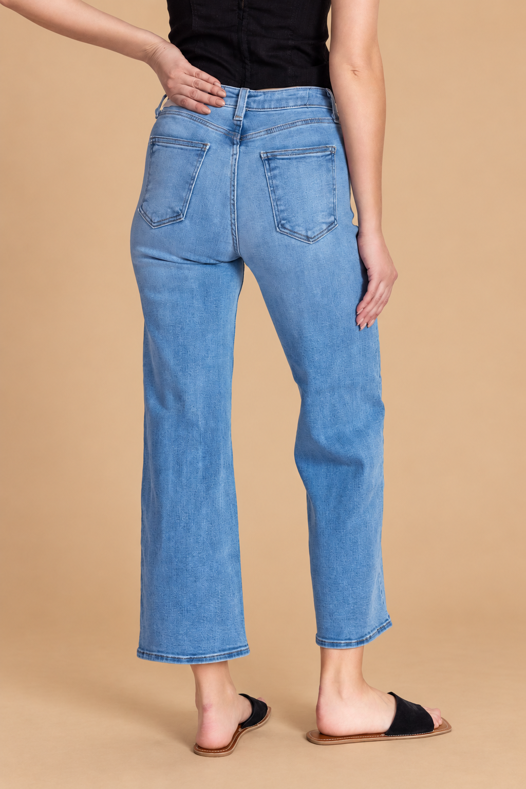 California Classic Wide Leg Jeans — Medium Wash, back view on tan background