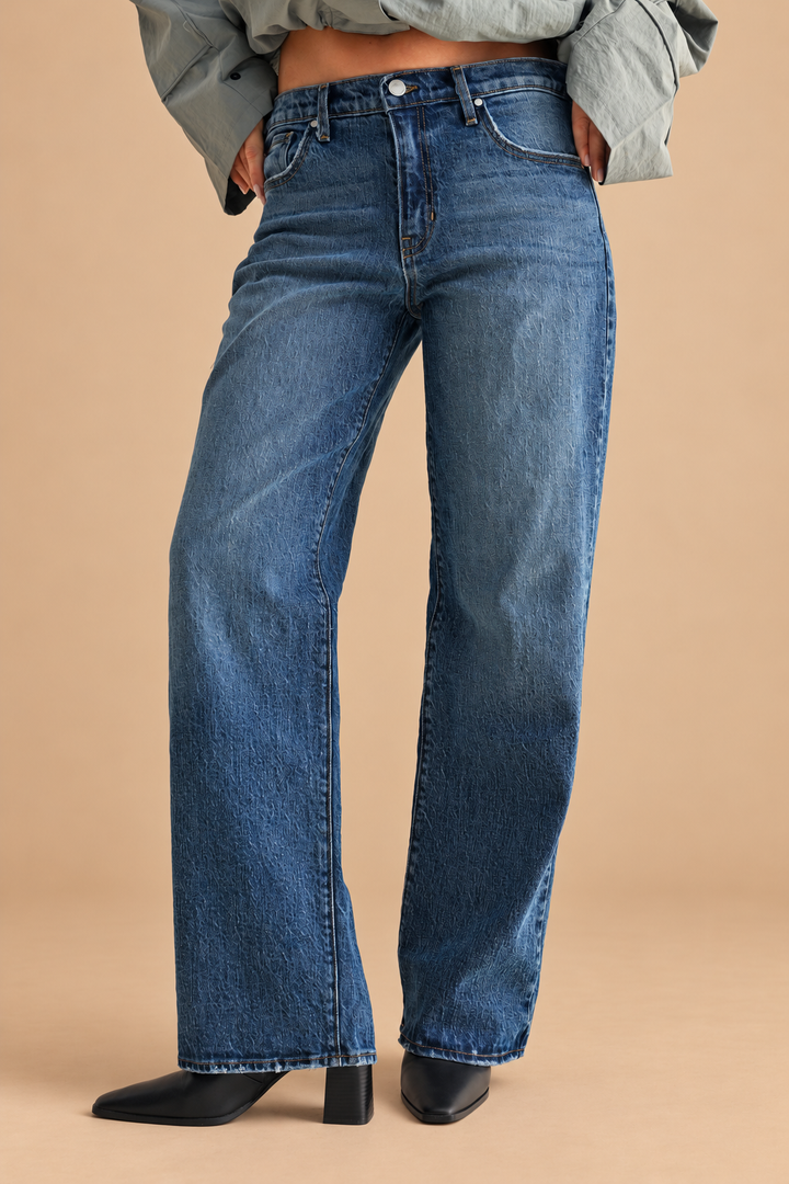 Lightweight Relaxed Straight Jean — Dark Denim, front view on tan background