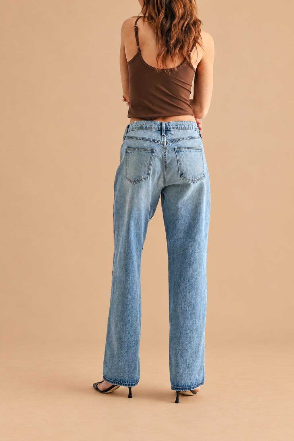 Lightweight Relaxed Straight Jean — Light Denim, back view on tan background