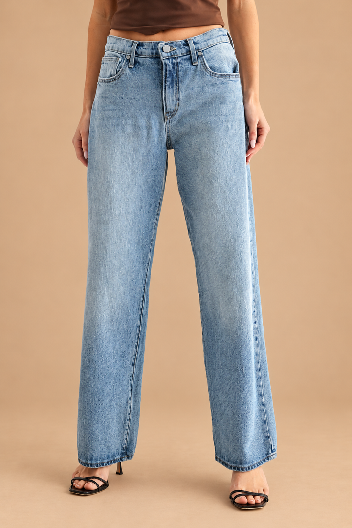 Lightweight Relaxed Straight Jean — Light Denim, front view on tan background