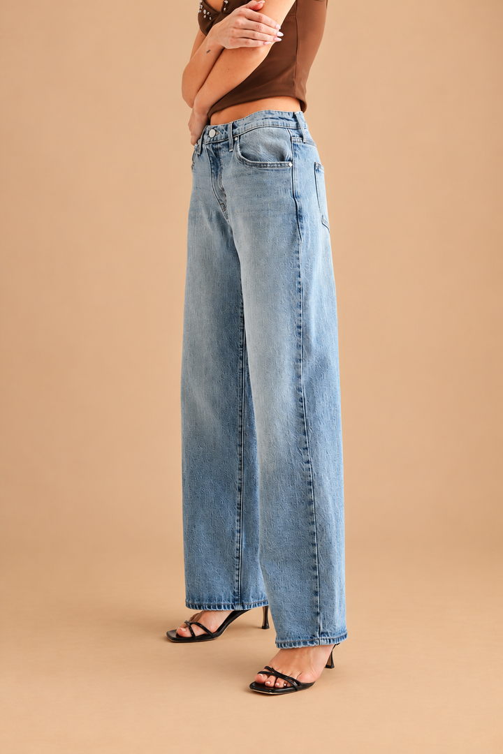 Lightweight Relaxed Straight Jean — Light Denim, side view on tan background