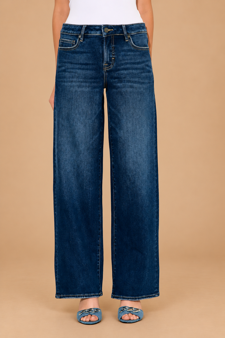 Logan Relaxed Jean — Dark, front view on tan background