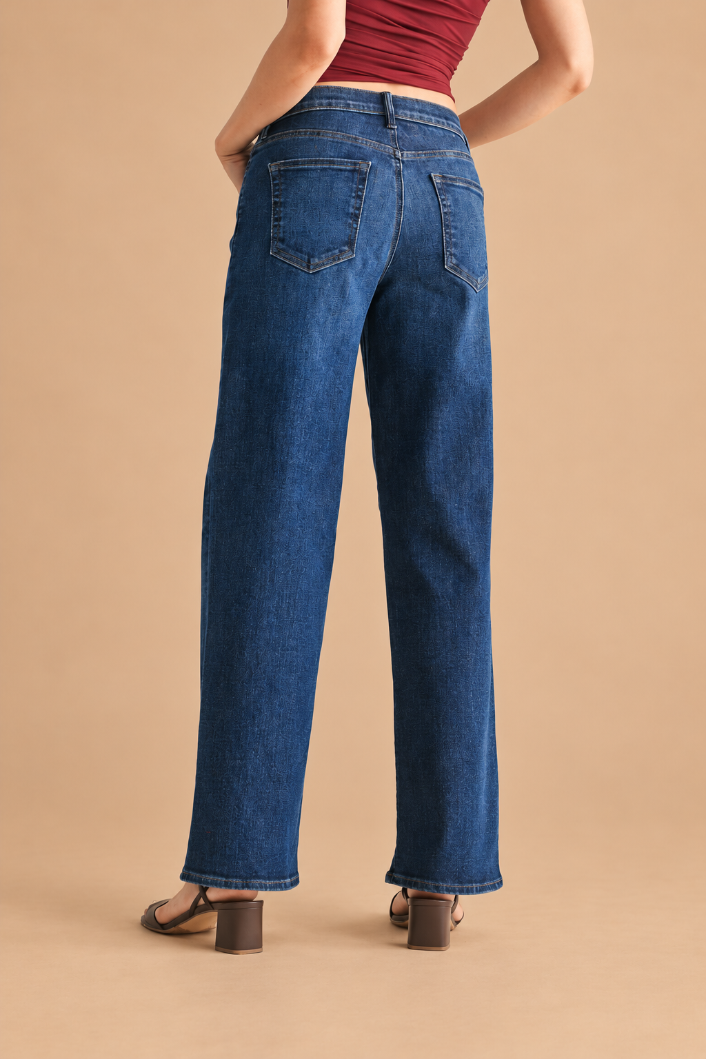 Loose Straight Jean — Dark Wash, back view on tan background