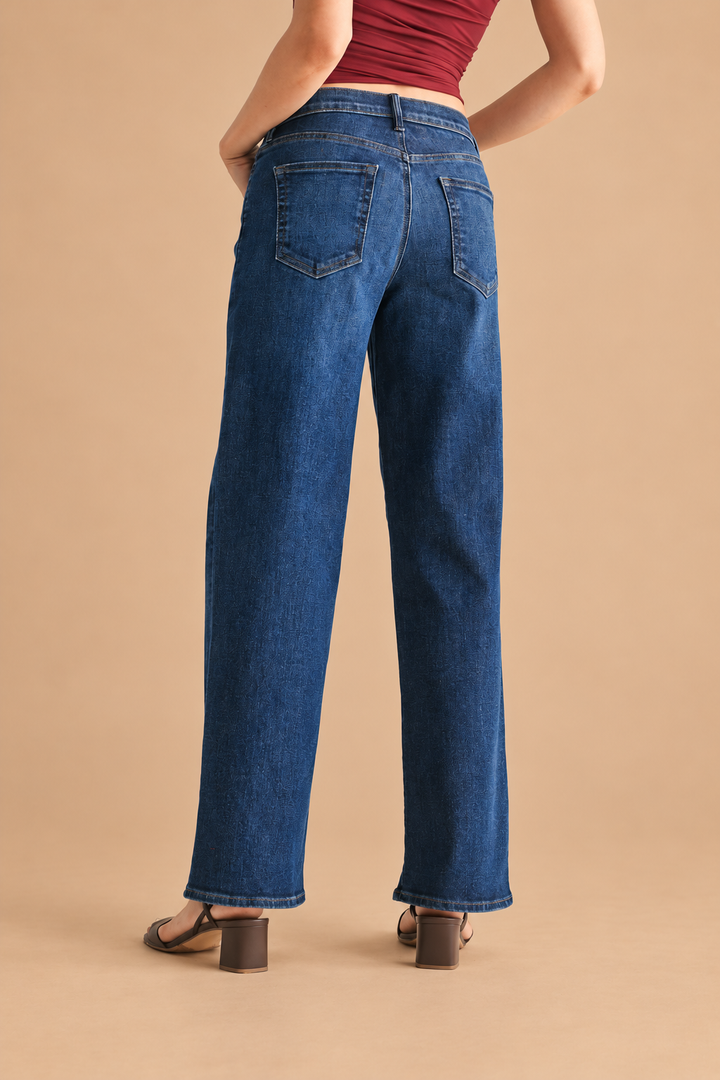 Loose Straight Jean — Dark Wash, back view on tan background
