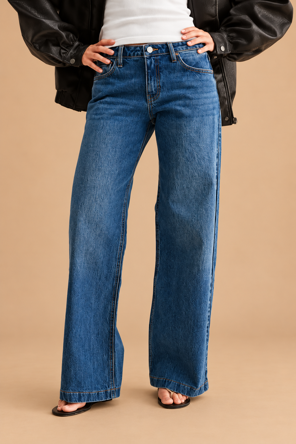 Low Rise Baggy Jean — Dark Denim, front view on tan background