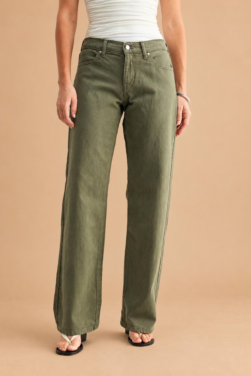 Low Rise Relaxed Straight Leg Jean — Dark Olive, front view on tan background