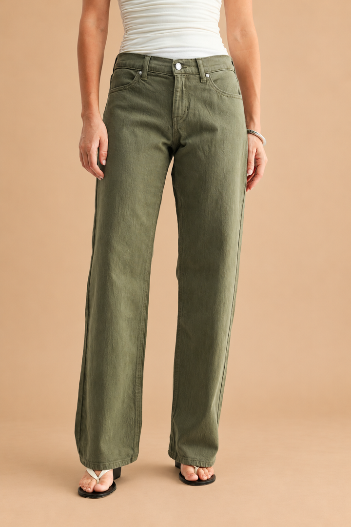 Low Rise Relaxed Straight Leg Jean — Dark Olive, front view on tan background