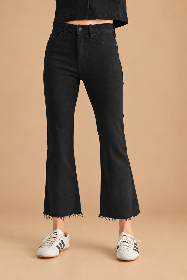 Marnie Cropped Flare Jean — Black, front view on tan background