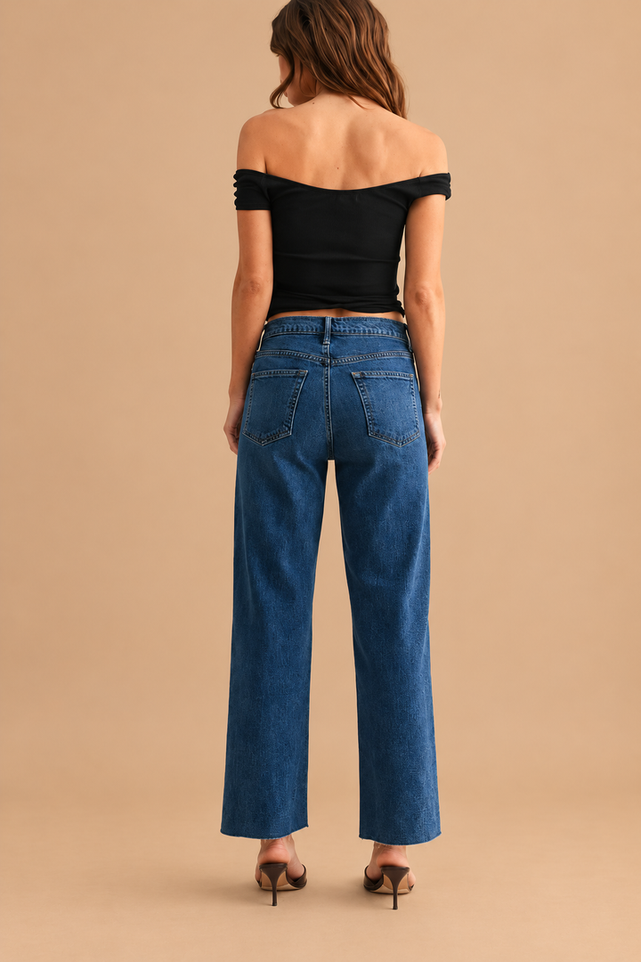 Classic Straight — Dark Denim, back view on tan background