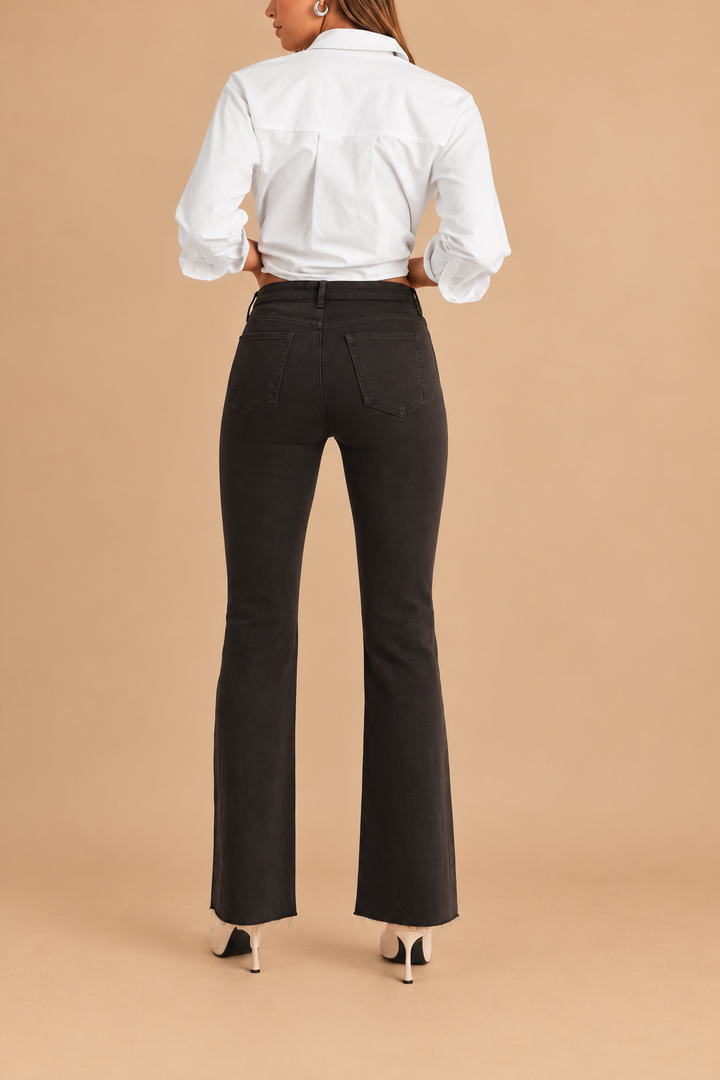 Scissor Cut Flare Jean — Dark Chocolate, back view on tan background
