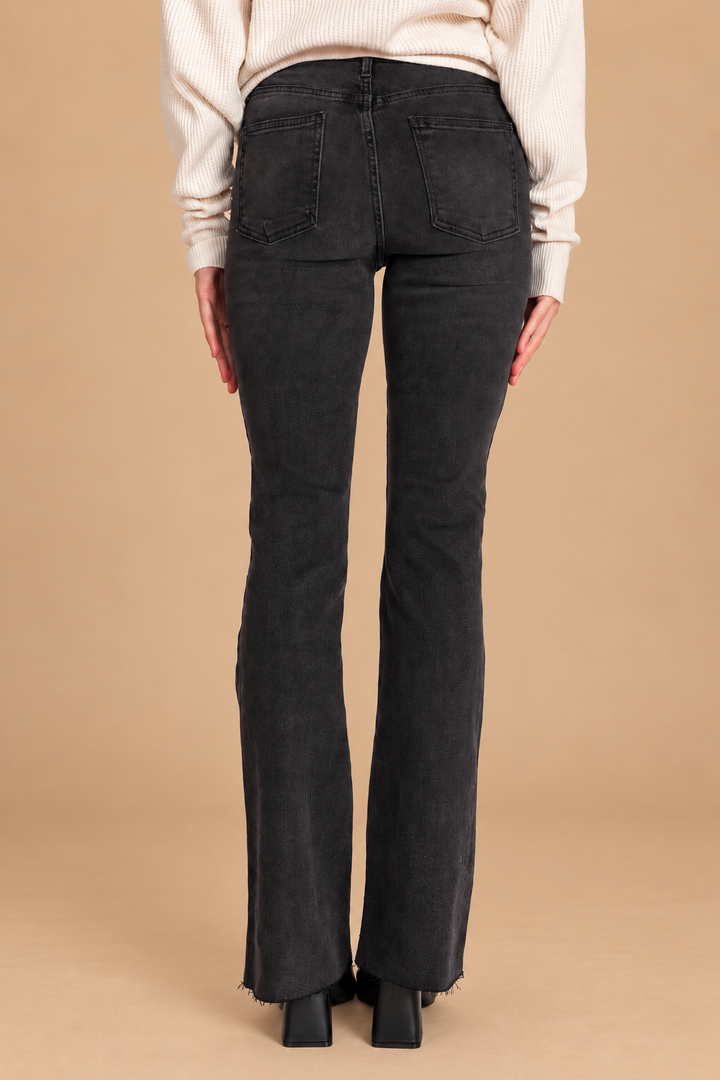Scissor Cut Flare Jean — Washed Black, back view on tan background