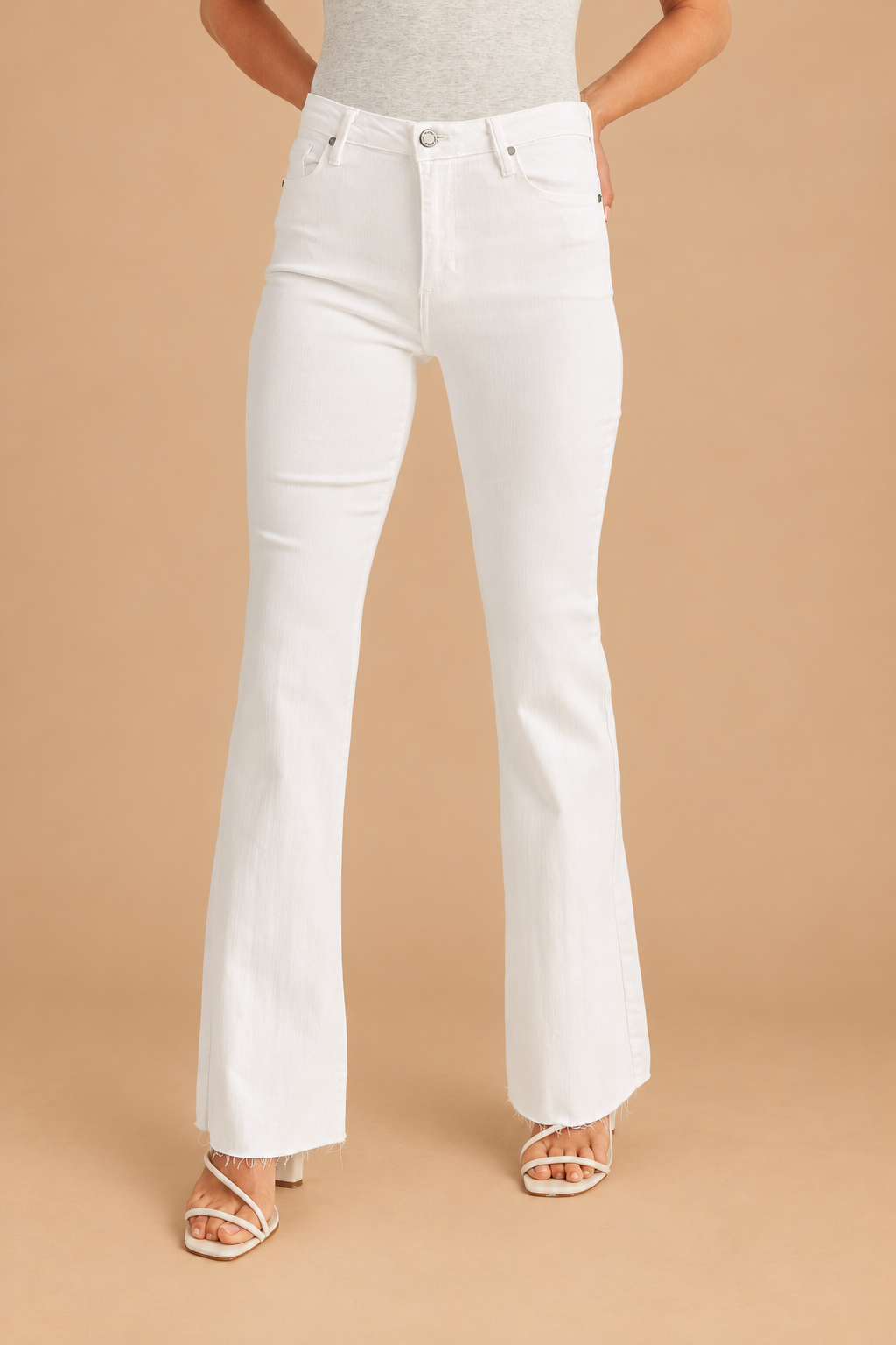 Scissor Cut Flare Jean — Optic White, front view on tan background