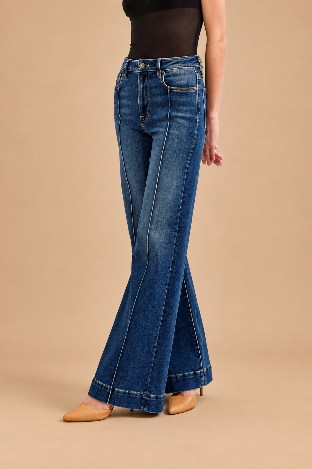 Ann Pintuck Flare Jean — Dark, side view on tan background
