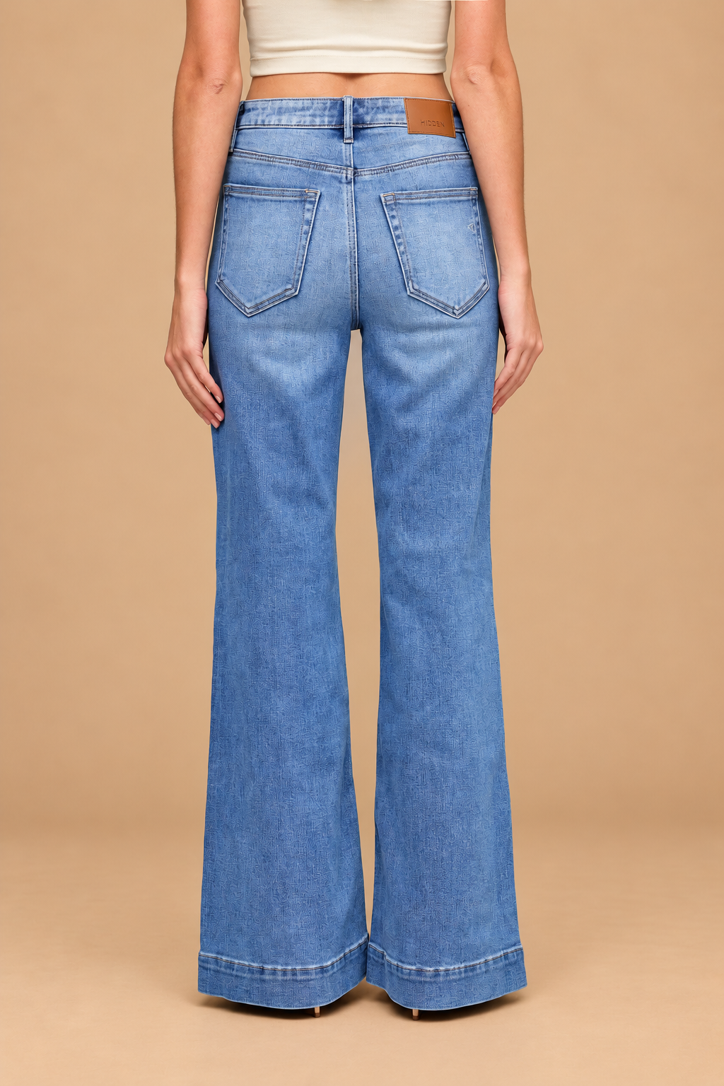 Ann Pintuck Flare Jean — Medium, back view on tan background