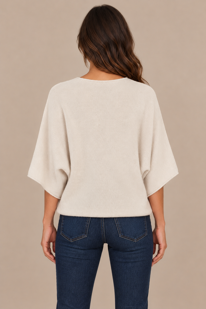 Christine Beige sweater back — correct thin hem, brunette campaign model