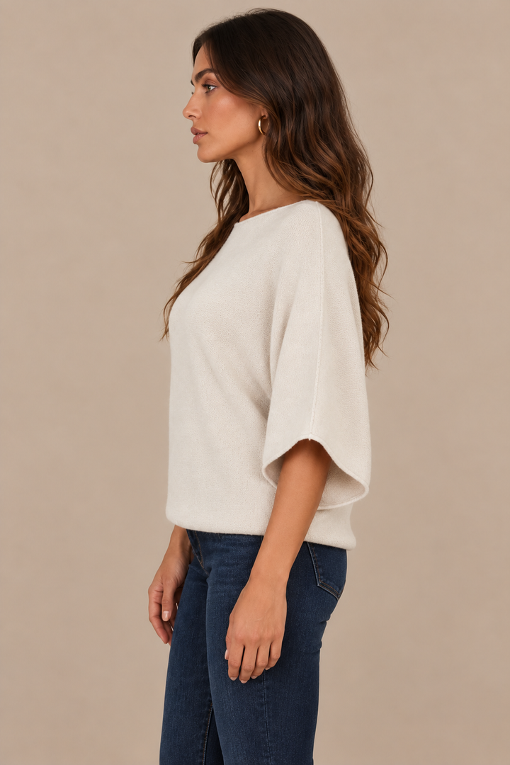 Christine Beige sweater side — correct thin hem, brunette campaign model