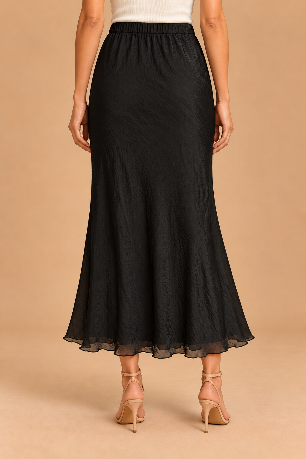 Maeve Silky Midi Skirt — Black, back view with heels